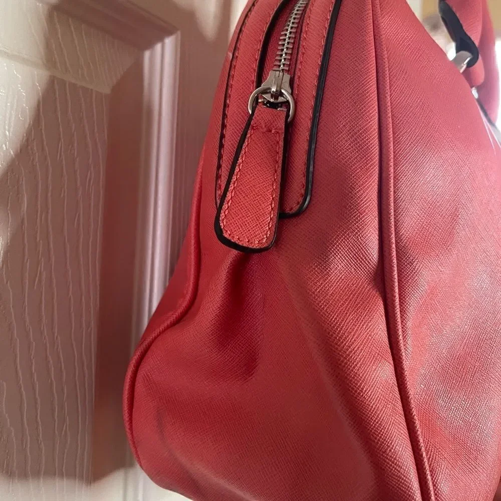 Guess bright orange satchel/Shoulder bag with gold tone hardwares.